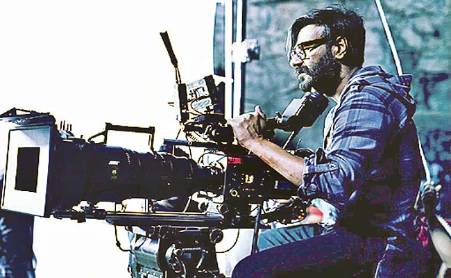 Ajay Devgn To Direct Hindi Remake Of Tamil Hit Kaithi - Sakshi