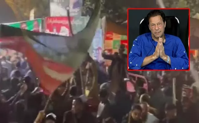 PTI Workers Camp Outside Imran Khan Lahore Home To Arrest Bid - Sakshi