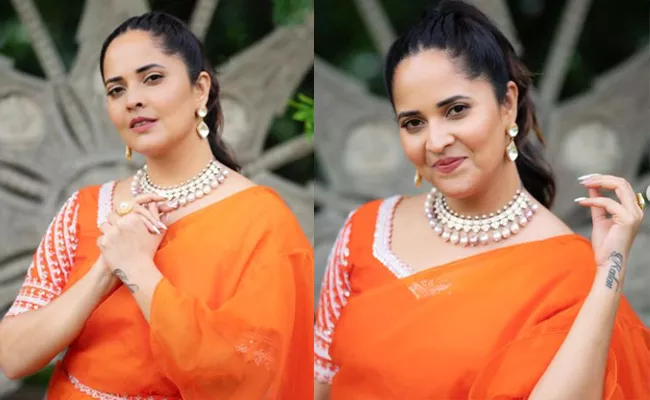 Anasuya Bharadwaj Stuns In Orange Ruffle Saree Brand Price Details - Sakshi