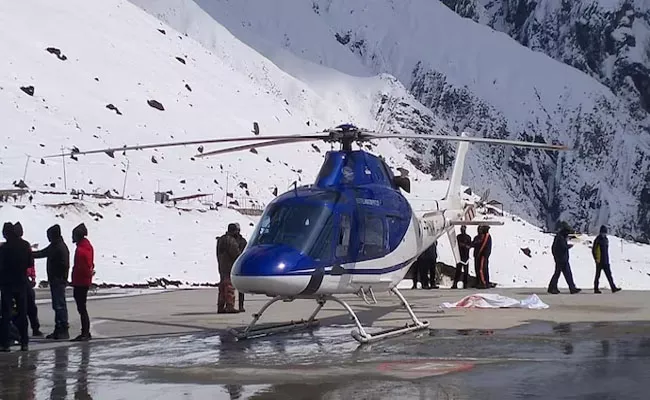 Government Official In Uttarakhand While Taking Selfie In Chopper  - Sakshi