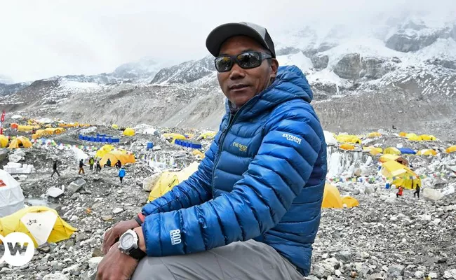 Nepali sherpa scales Mount Everest for record 27th time - Sakshi