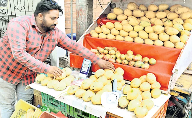 Mangoes flooding the market - Sakshi