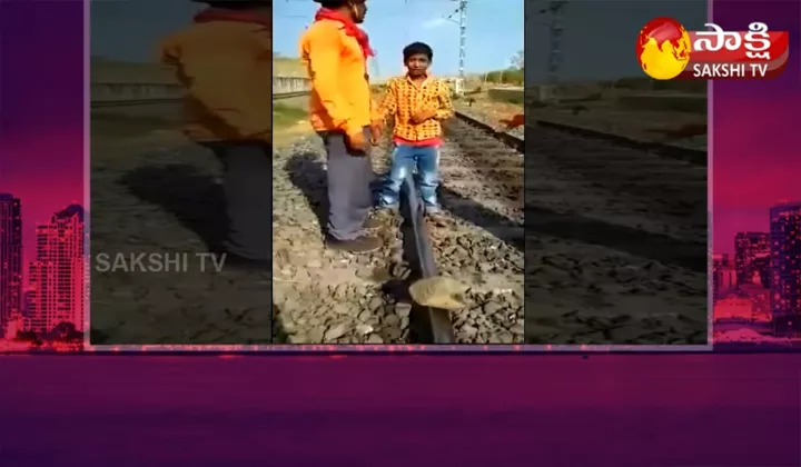 Boy Placing Stones On Railway Track In Karnataka