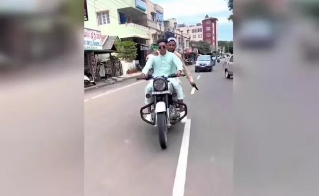 Karnataka: Police Arrested Youth Wheeling On A Bike With A Pistol - Sakshi