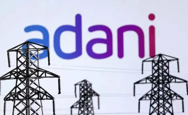 UAE TAQA seeks to invest up to usd 2bln in Adani power business report - Sakshi