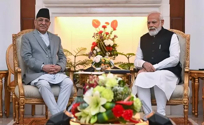 PM Narendra Modi, Pushpa Kamal Dahal review India-Nepal bilateral cooperation - Sakshi