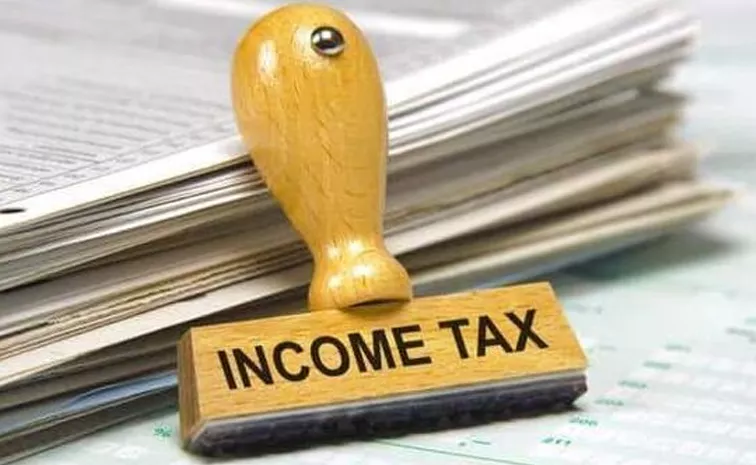 Modi govt mulls income tax rate cut says report