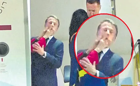 Macron plays down apparent shove from wife in Vietnam