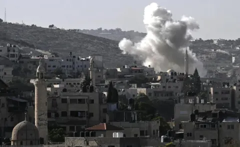 Israeli attacks kill at least 26 people in gaza