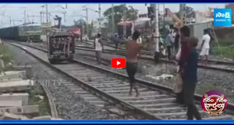 A Man Driving Auto On Railway Track
