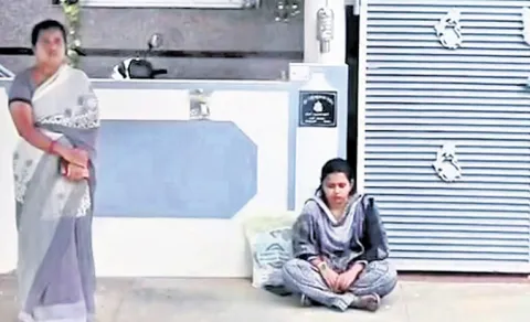 Married Woman Stages Protest in Front of Husband House