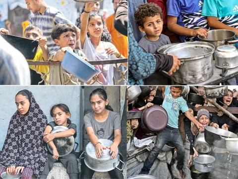 Palestinians wait for donated food at a community kitchen in Gaza City