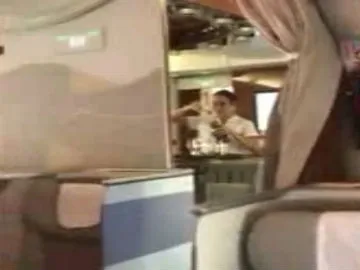 Passengers spot flight attendant pouring champagne BACK into the bottle