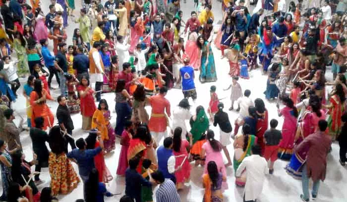 Gujaratis celebrate the Dandiya Dance in the festival of Dasara - Sakshi