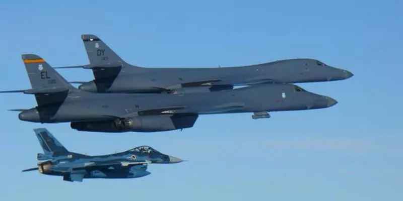 US bombers fly close to North Korea in show of force - Sakshi