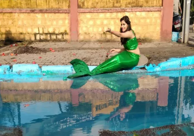 Mermaid in Bengaluru's Pothole