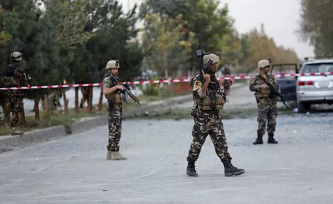 Suicide Bomber, Gunmen Attack Police HQ In Afghan Province - Sakshi