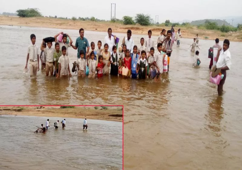 school students crossing papaghni river going to school