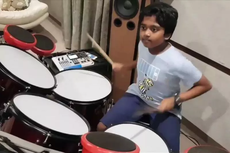 Director Maruthi Son Aasreesh Playing Drums - Sakshi