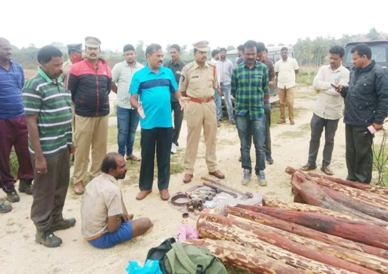 police firing on red wood smugglers - Sakshi