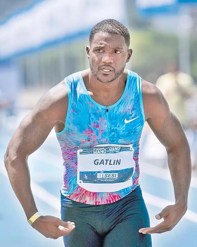 Drugs cheat Justin Gatlin left out of athlete - Sakshi