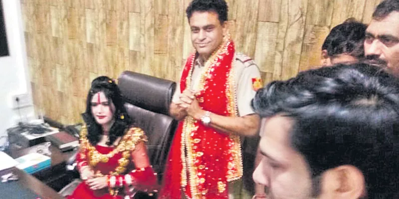 Radhe Maa sits in SHO's chair - Sakshi