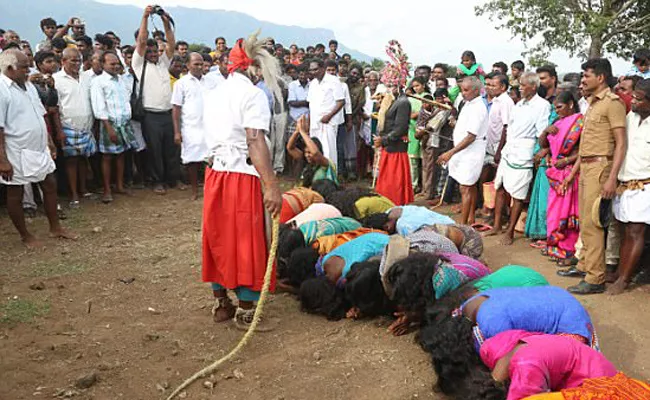 women writhing in pain as they're whipped by priests