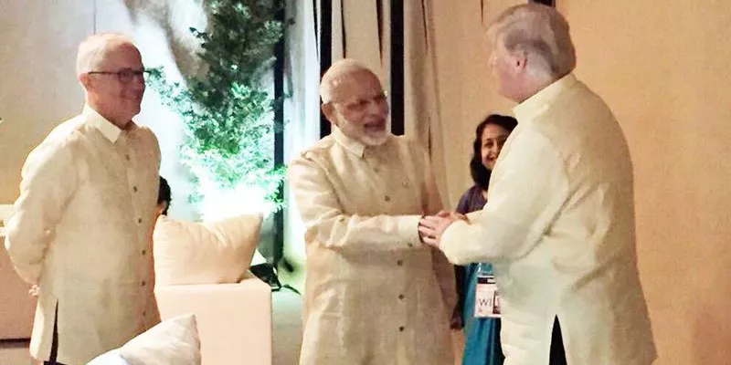 PM Modi briefly meets Donald Trump, world leaders at ASEAN gala dinner - Sakshi