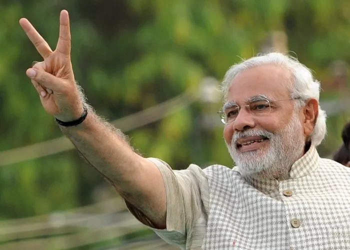 Modi remains popular leader in india - Sakshi