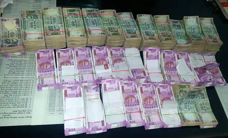 I-T dept seizes Rs.11 crore cash in raids related to NSE co-location case - Sakshi