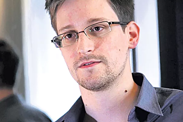 Not FIR but awards for journalists exposing Aadhaar breach: Edward Snowden - Sakshi