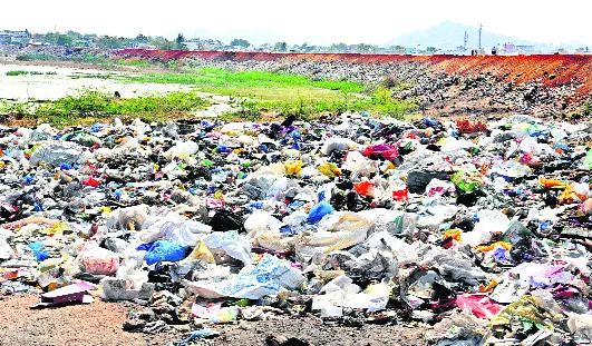 lake turned into dump yard in wanaparthy - Sakshi