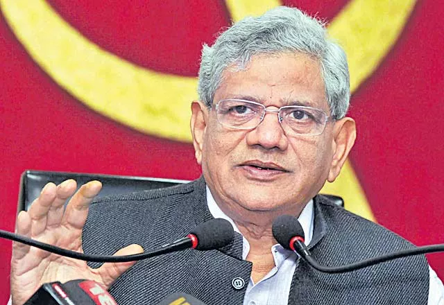 CPM decides against alliance with Congress as Prakash Karat wins out over Sitaram Yechury - Sakshi