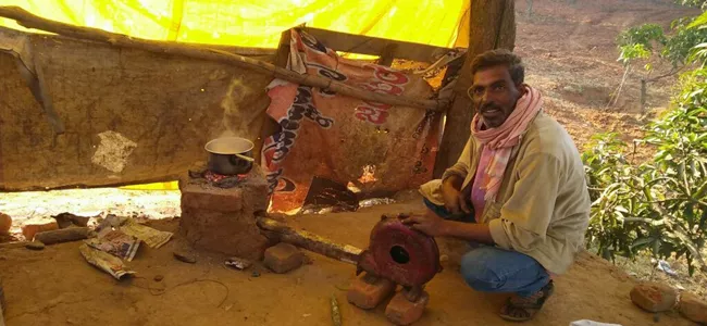 cooking on stick stove in hotel - Sakshi