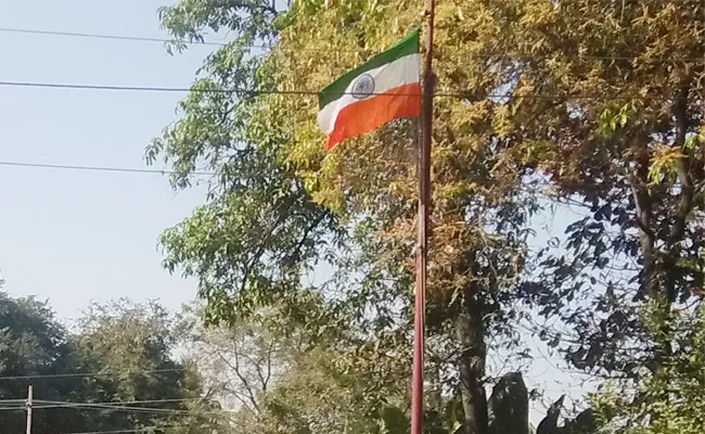 insulted to national flag in Adilabad - Sakshi