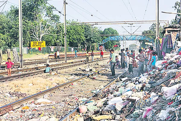 concrete walls construction both sides of rail tracks - Sakshi