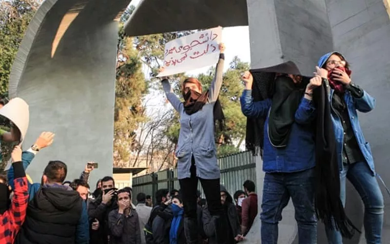 Pro-government supporters take to Iran's streets in counter-protest - Sakshi