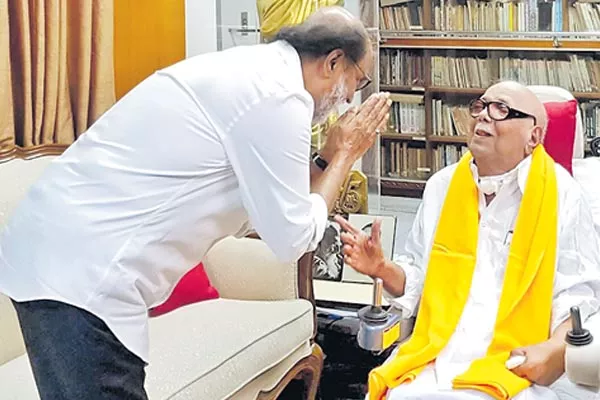 Rajinikanth meets DMK chief Karunanidhi. - Sakshi