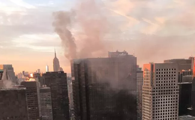 Fire breaks out at Trump Tower in New York - Sakshi