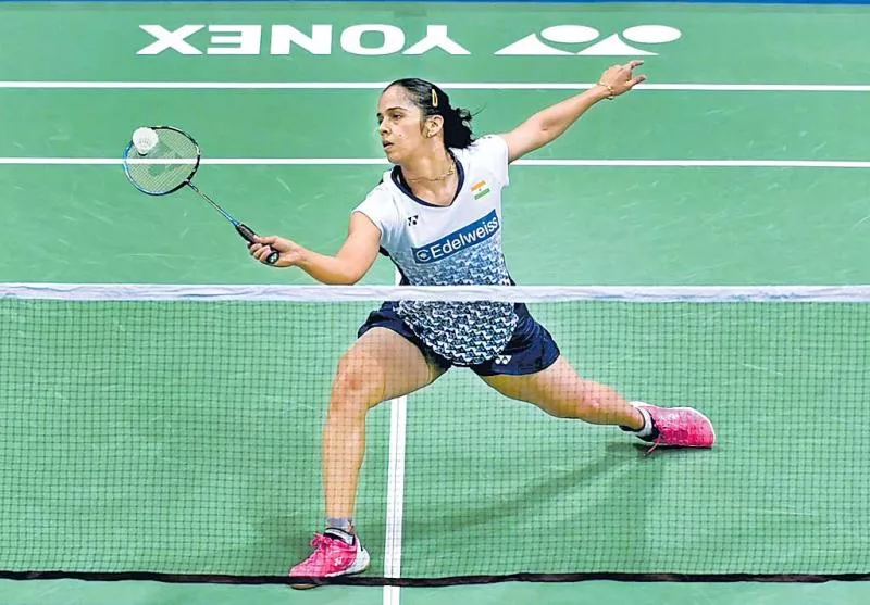 Saina Nehwal and P V Sindhu advanced to the second round - Sakshi