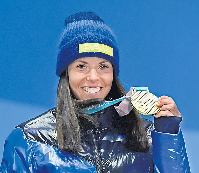  Marit Bjoergen becomes most decorated female Winter Olympian in history - Sakshi