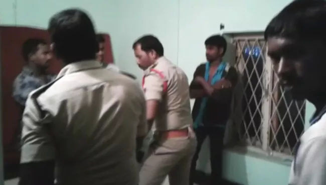 police beats youth in achanta police stations, video viral - Sakshi