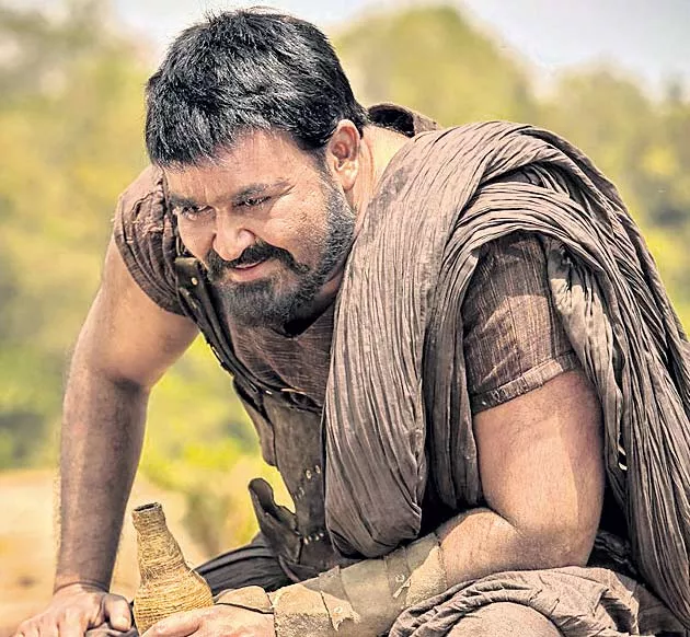 Mohanlal as Ithikkara Pakki in Nivin Pauly’s Kayamkulam Kochunni - Sakshi