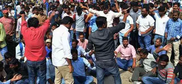 students, unemployees protest against railway notification - Sakshi