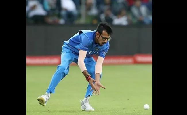 chahal father reveals  why his son wears glasses in fielding - Sakshi