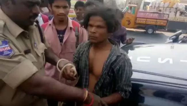 psycho hulchul in kphb metro railway station - Sakshi