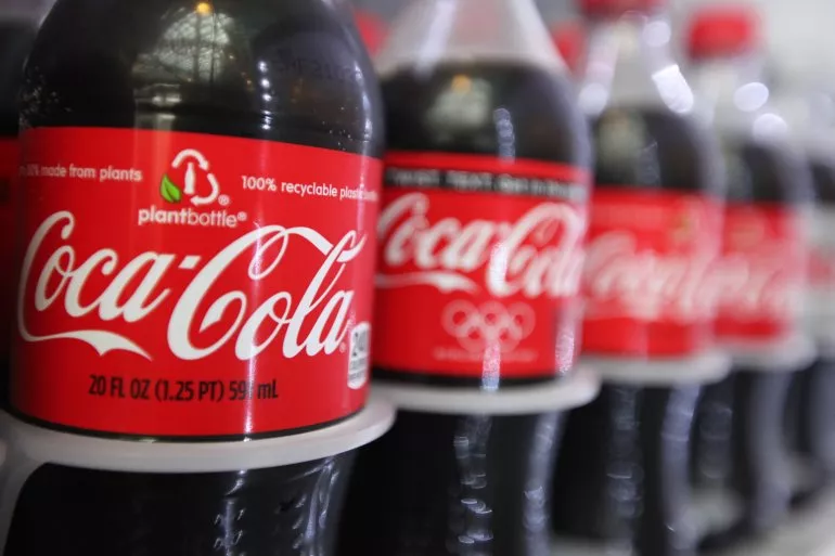 coca cola plans to launch alcoholic drink - Sakshi