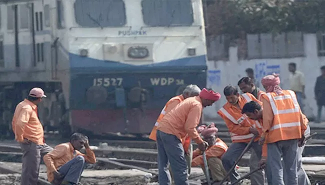 railway employees protest to increase salaries - Sakshi