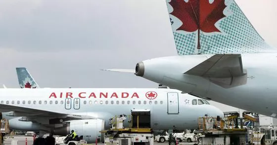 Cell phone catches fire onboard Canada flight - Sakshi