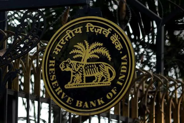 RBI  penalty on Axis Bank, IOB - Sakshi